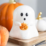 Brandende Halloween theelichthouder in de vorm van een wit spookje met pompoen