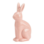 Sierlijk roze keramisch haasje van 16 cm hoog met een glanzende afwerking, perfect als luxe paasdecoratie voor een modern interieur.