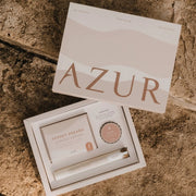 Een geopende roze AZUR geschenkdoos met de tekst 