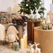 Glazen theelichthouder met winterbos