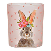 Detail van het matte roze glas en de fijne illustratie van het paaskonijn op de 10 cm hoge kaarshouder
