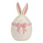 Luxe witte keramische voorraadpot in de vorm van een ei met konijnenoren op het deksel en een roze strik in reliëf